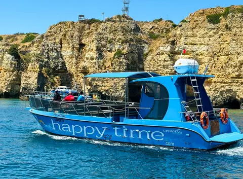 Catamaran Liberty departing Marina de Lagos for the Benagil Cave tour